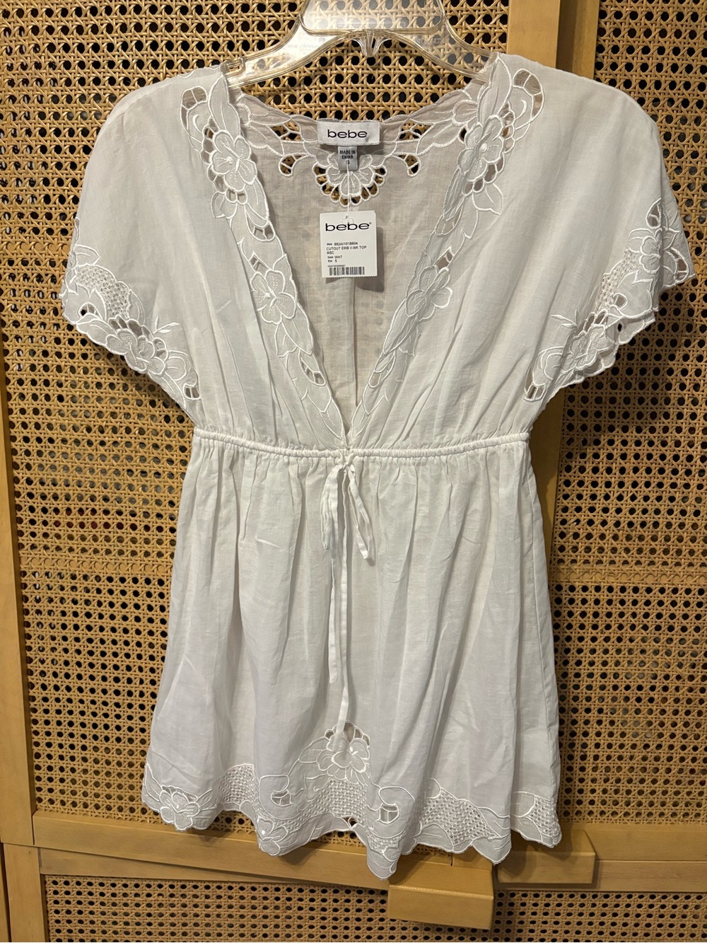 NWT Bebe cutout floral embroidered v neck blouse S